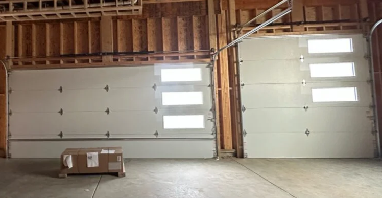 Technician performing a garage door replacement in Coral Springs, showcasing upgraded modern garage doors."